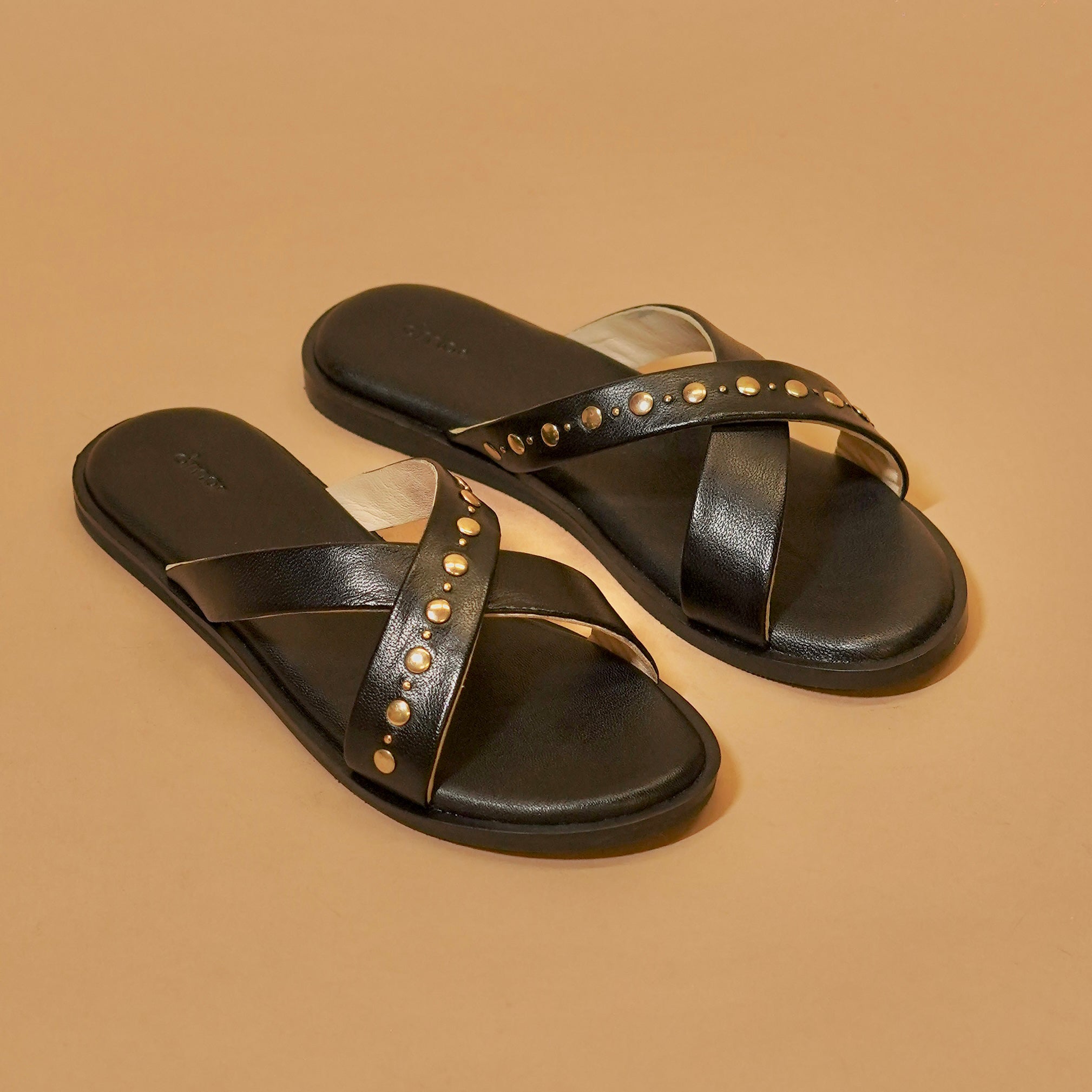 Black leather cross-strap slider with rivets