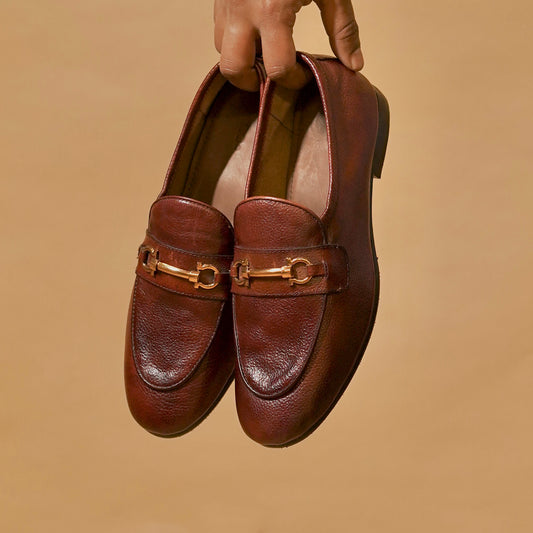 Three-quarter view of men’s horsebit loafers