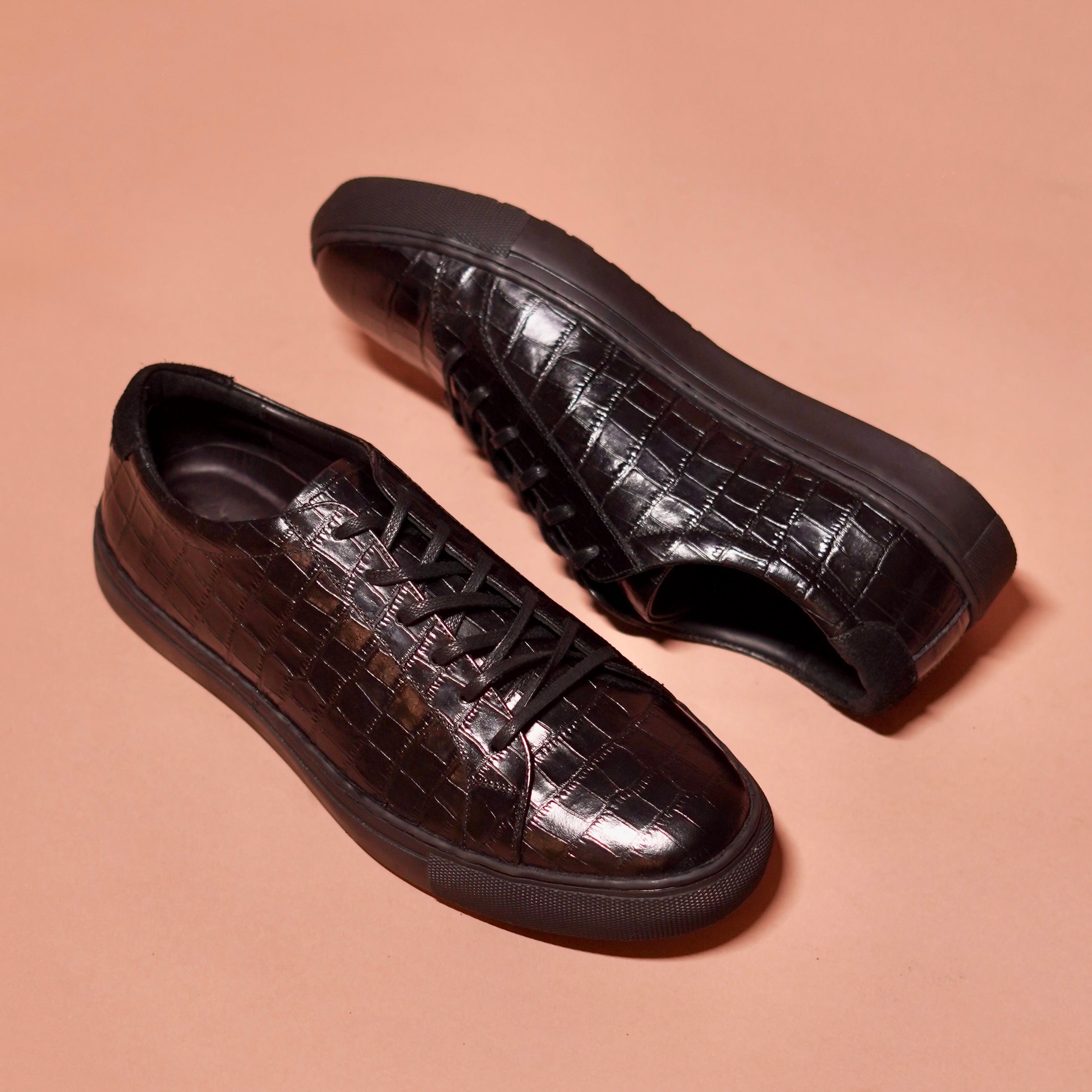 Close-up of Scarpo Croco’s suede detailing at the back