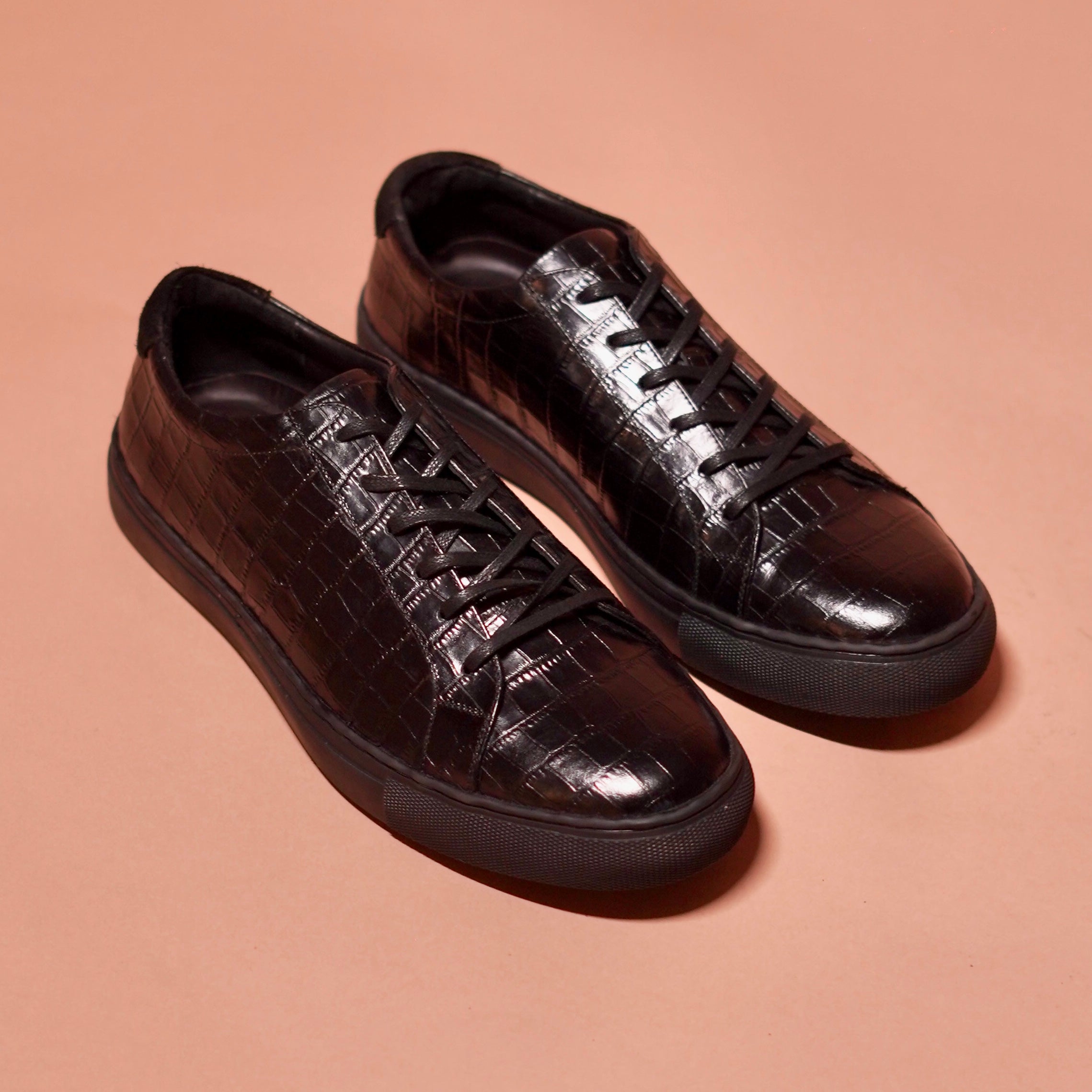 Scarpo Croco styled with a leather jacket and jeans for a bold, luxe look